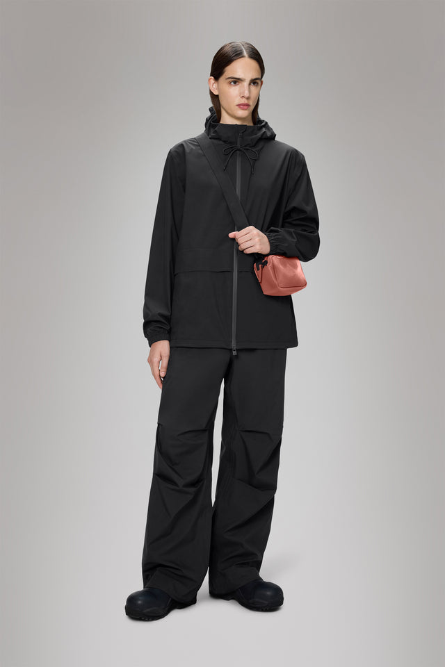 From the brand Rains Women's Suva Hardshell Pocket Jacket W3 in Black - abigail fashion