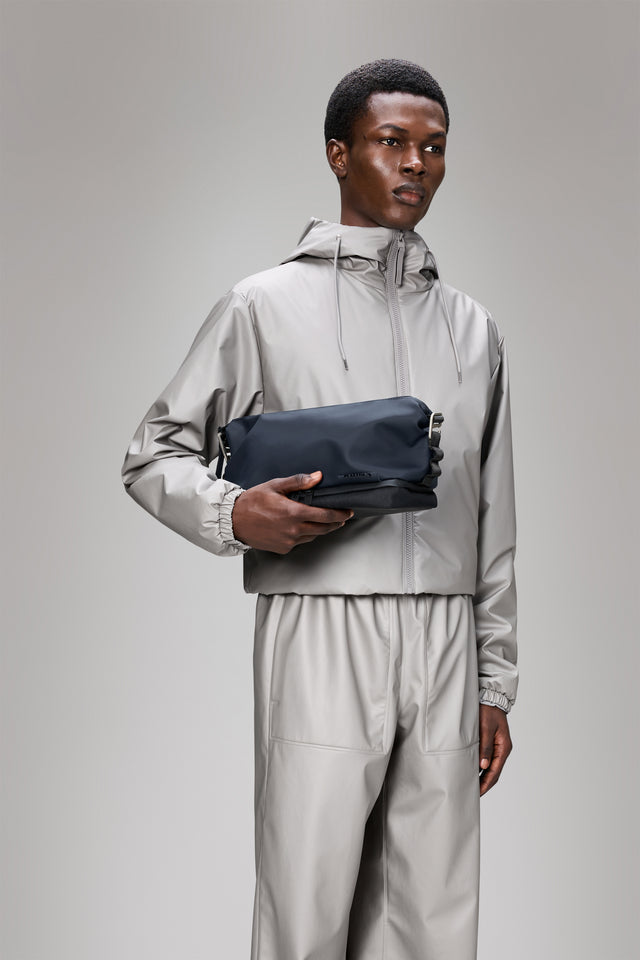 From the brand Rains Unisex Otaru Wash Bag W3 in Navy - abigail fashion