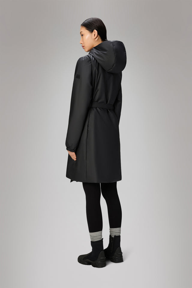 From the brand Rains Women's Lohja Long Insulated Curve Jacket W3T2 in Black - abigail fashion