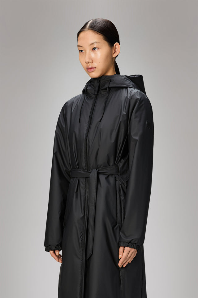 From the brand Rains Women's Lohja Long Insulated Curve Jacket W3T2 in Black - abigail fashion